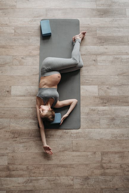 Working out keeps your body strong and fit, during and after the pregnancy. Working out during pregnancy A Pregnant Woman Exercising over a Yoga Mat